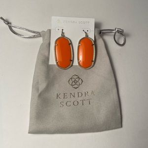 Elle gold drop earrings in orange.